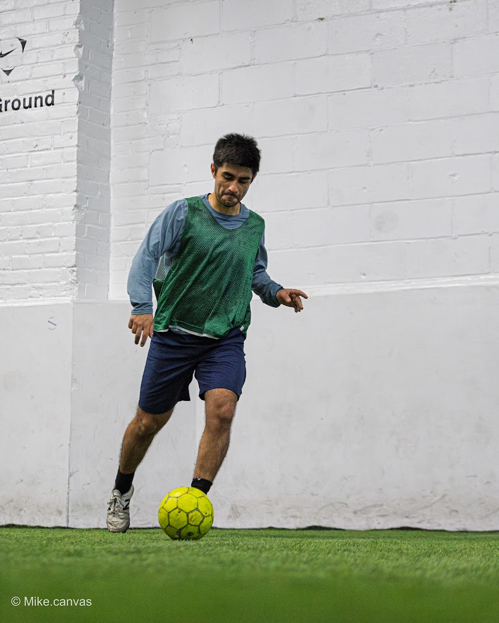 Player controlling soccer ball during game action
